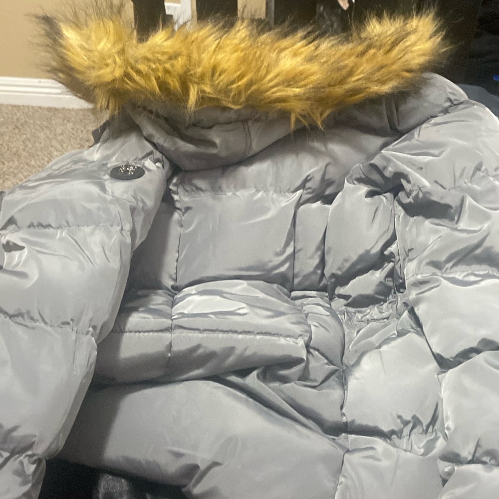 a cozy fluffy jacket with a furry hood